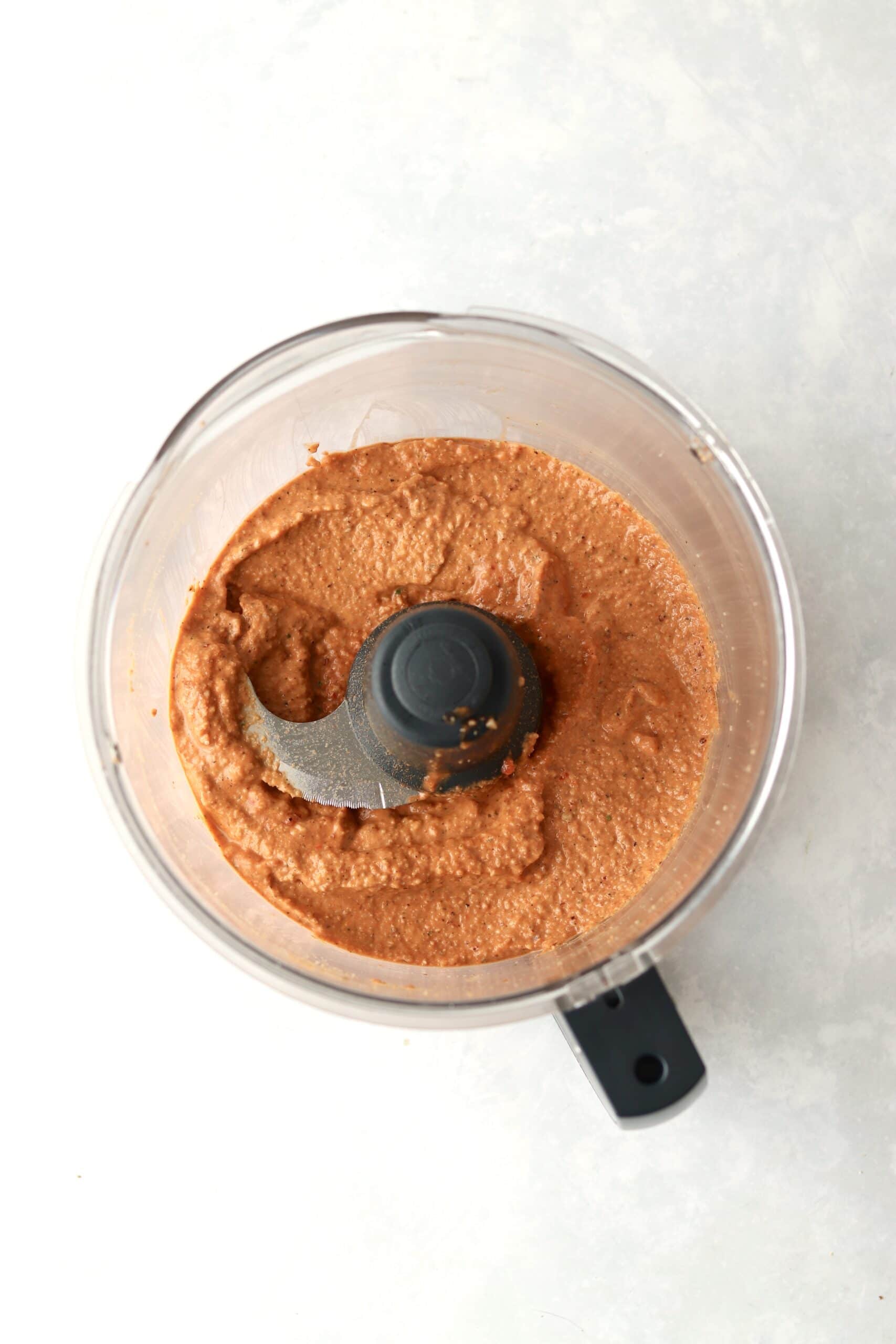 blended red pepper dip in a food processor