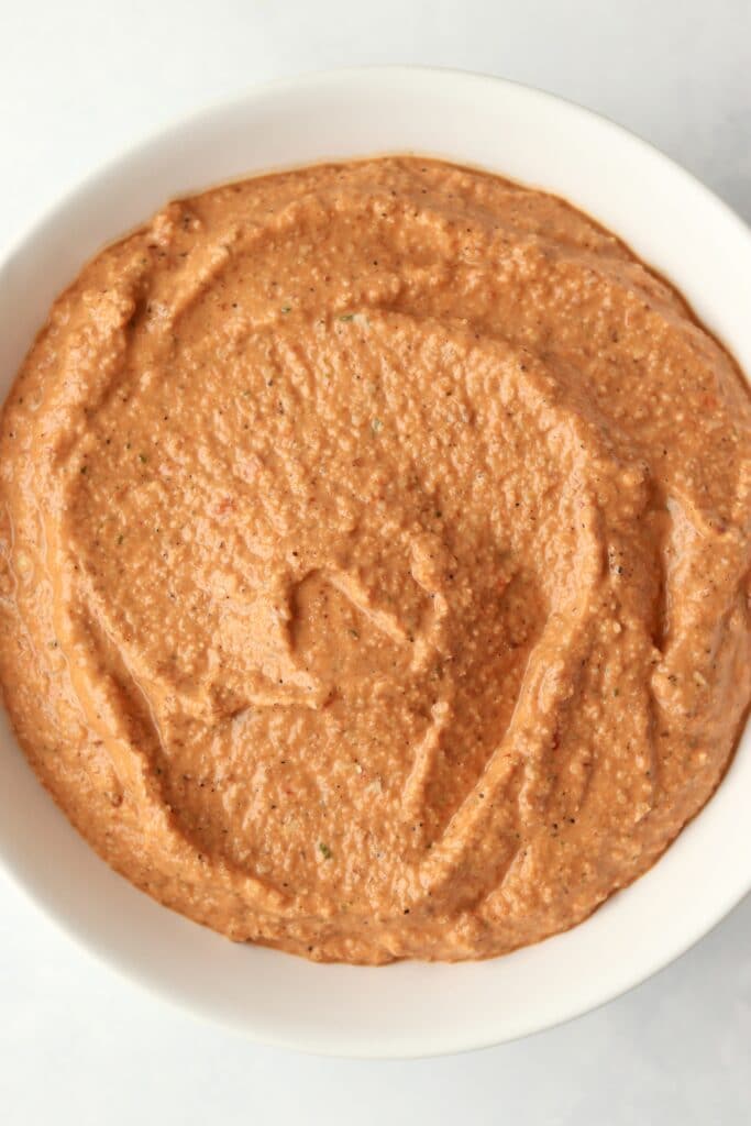 close up of red pepper almond dip
