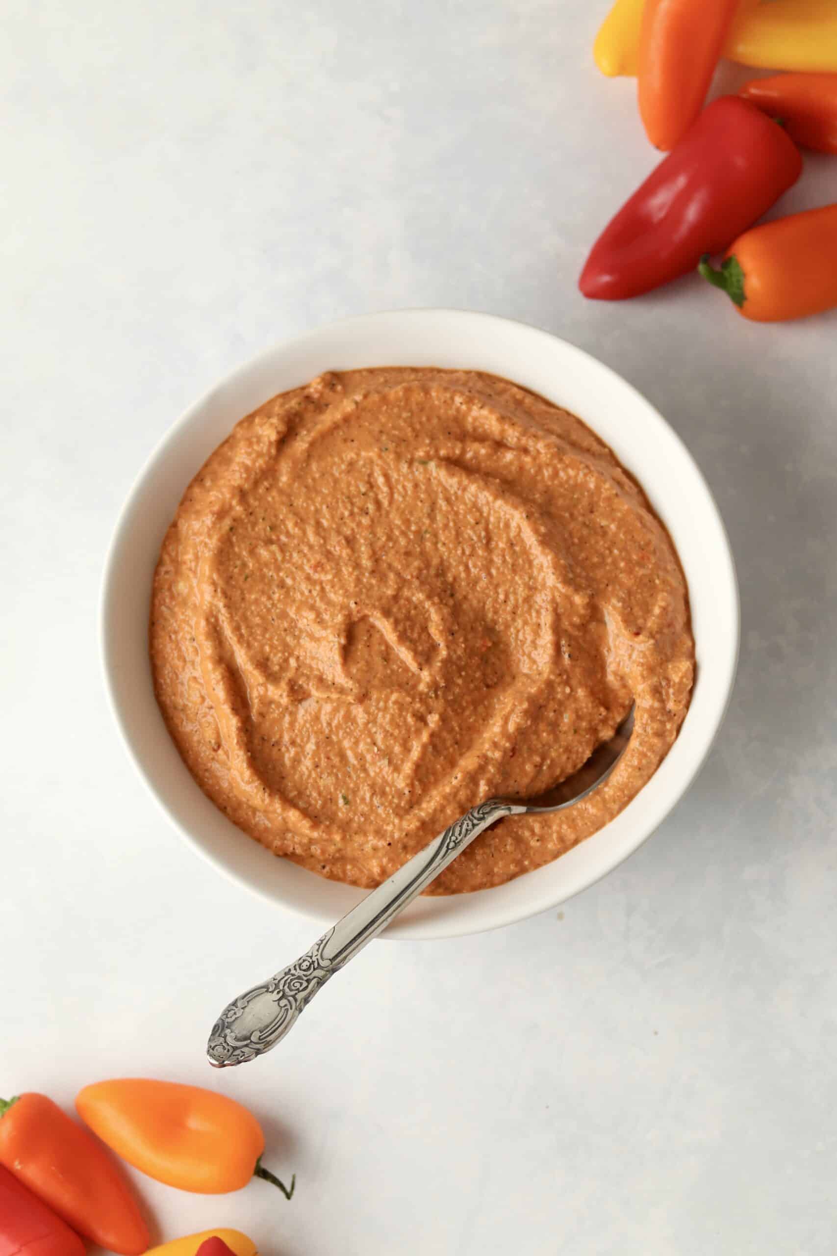 red pepper dip served with veggies