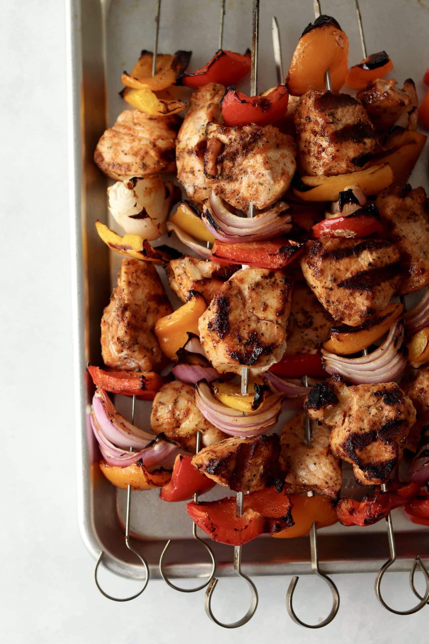cooked chicken and veggies on skewers