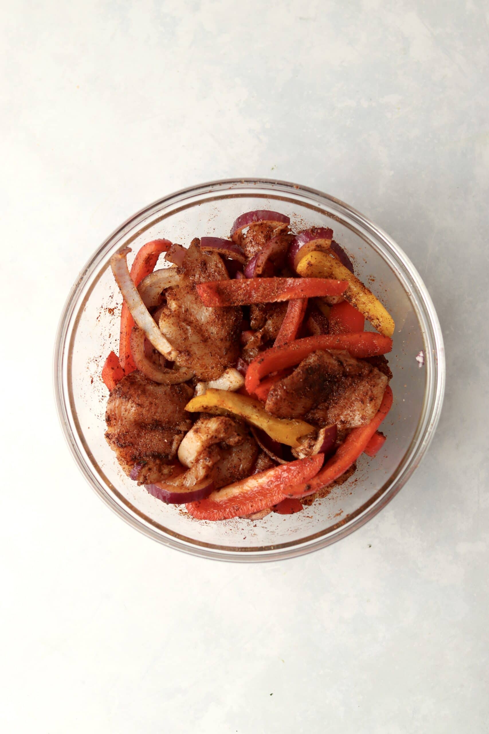 chicken and veggies in fajita seasonings 