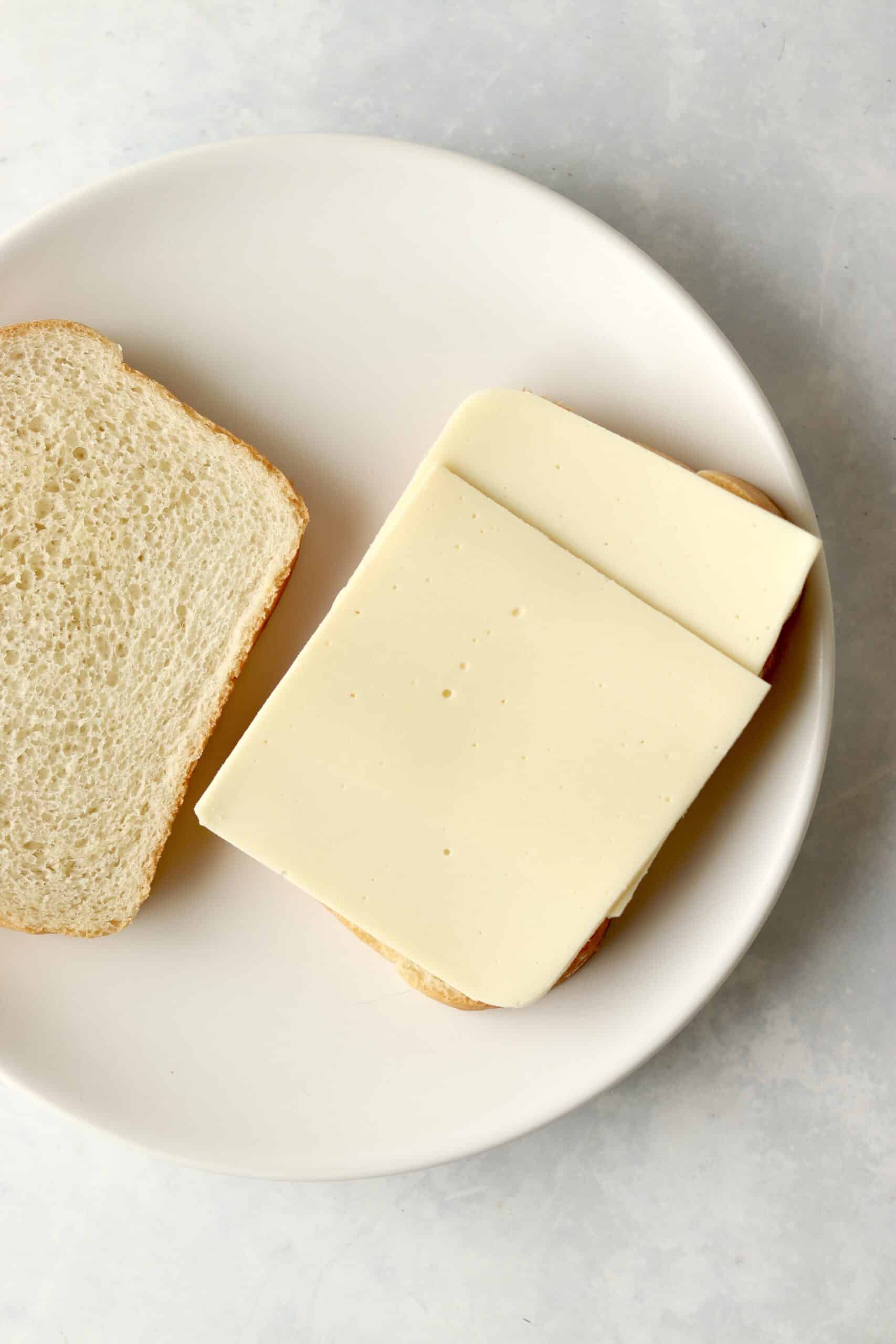 sliced white American cheese on bread.