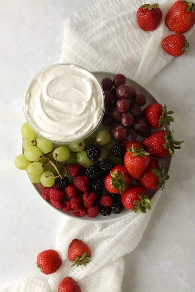 fruit dip on a platter with berries