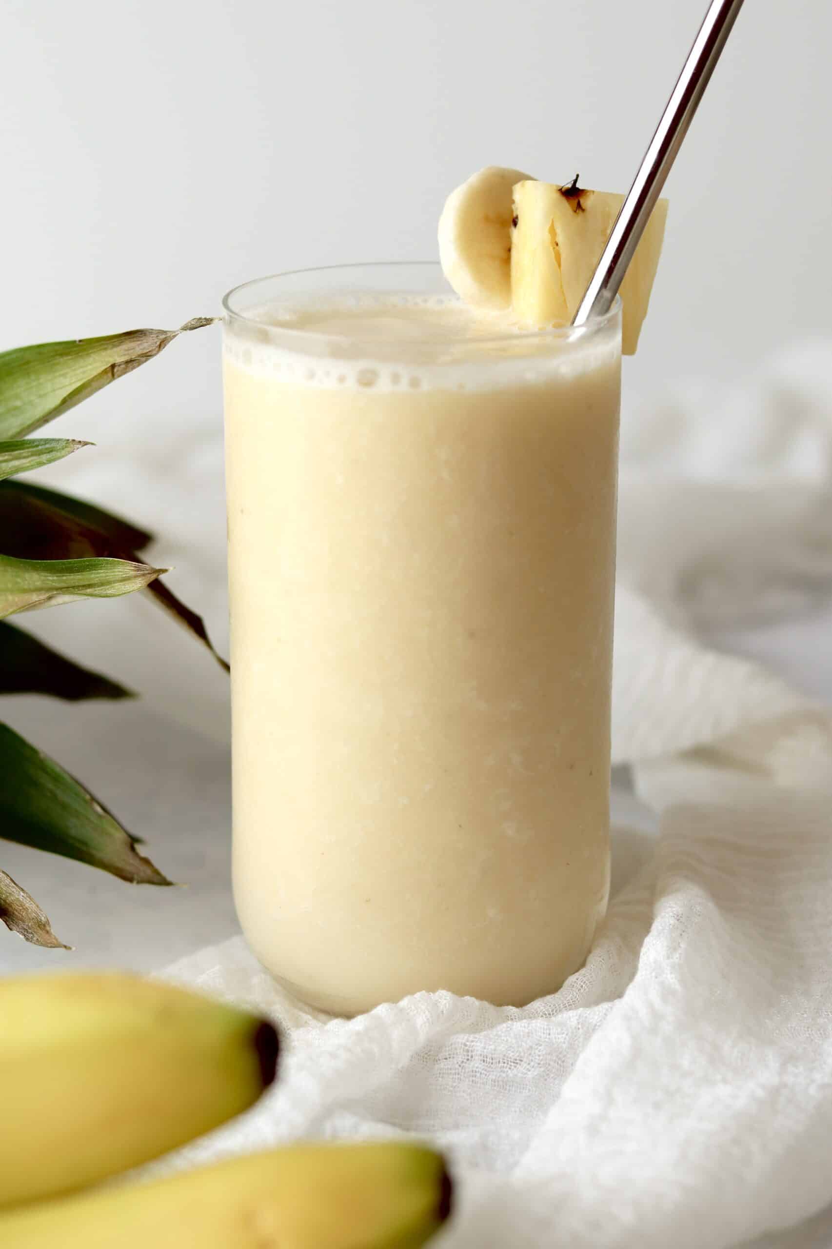 vegan banana pineapple smoothie in a glass