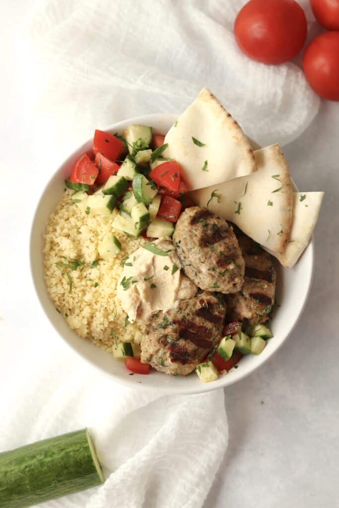 grilled chicken kofta in bowl with couscous