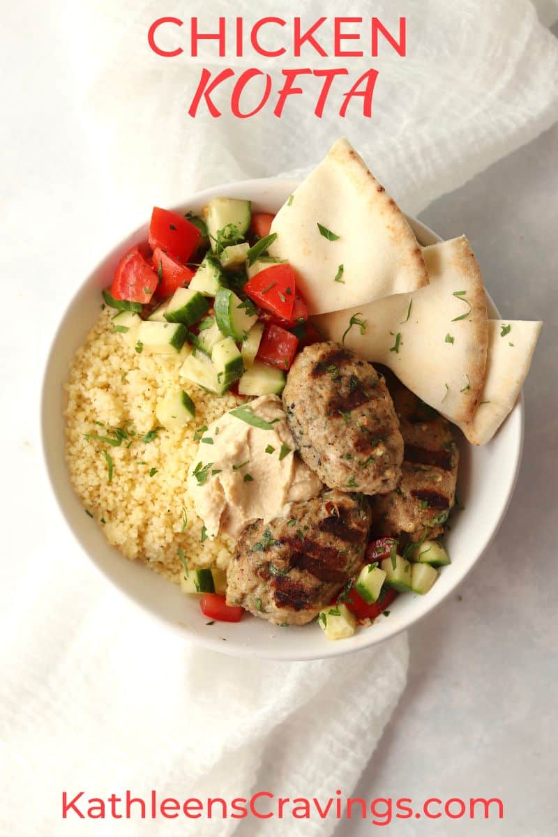 Chicken kofta in a bowl with pita, couscous, and hummus