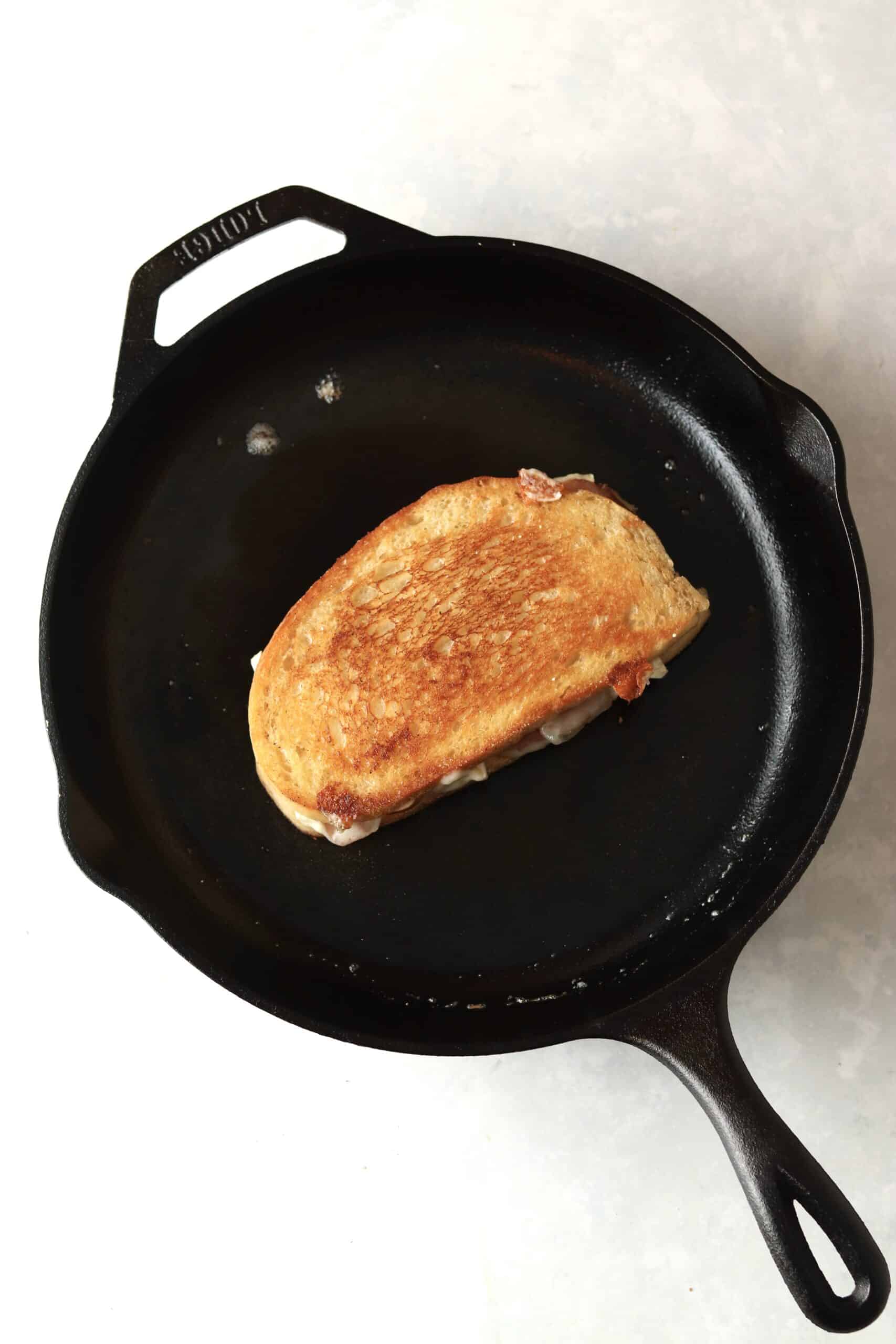 grilled cheese sandwich in cast iron skillet