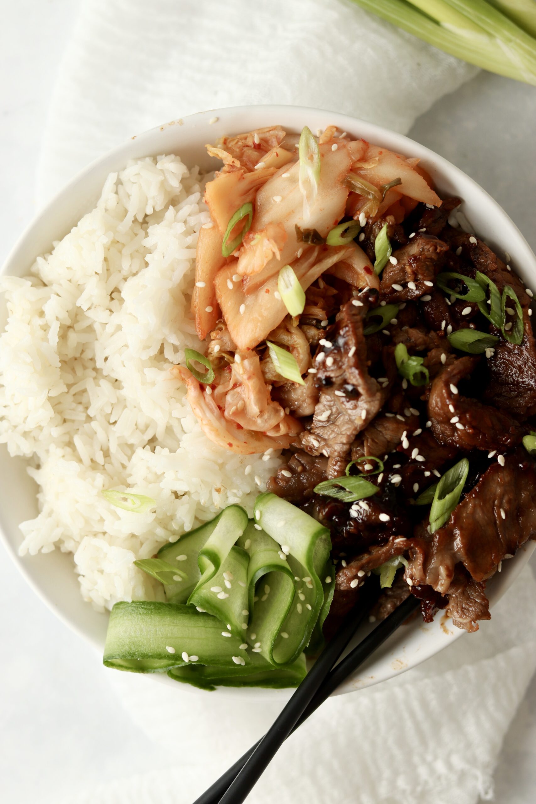 beef bulgogi rice bowl with kimchi.