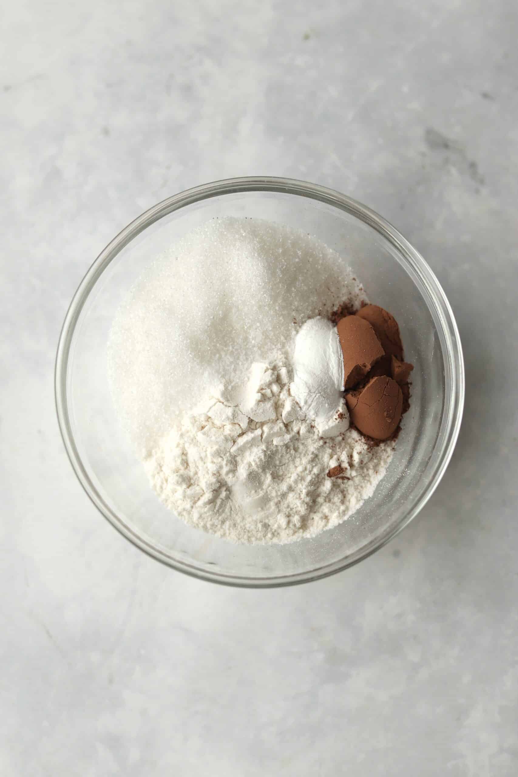 flour, cocoa powder, sugar, baking powder, and salt in a bowl