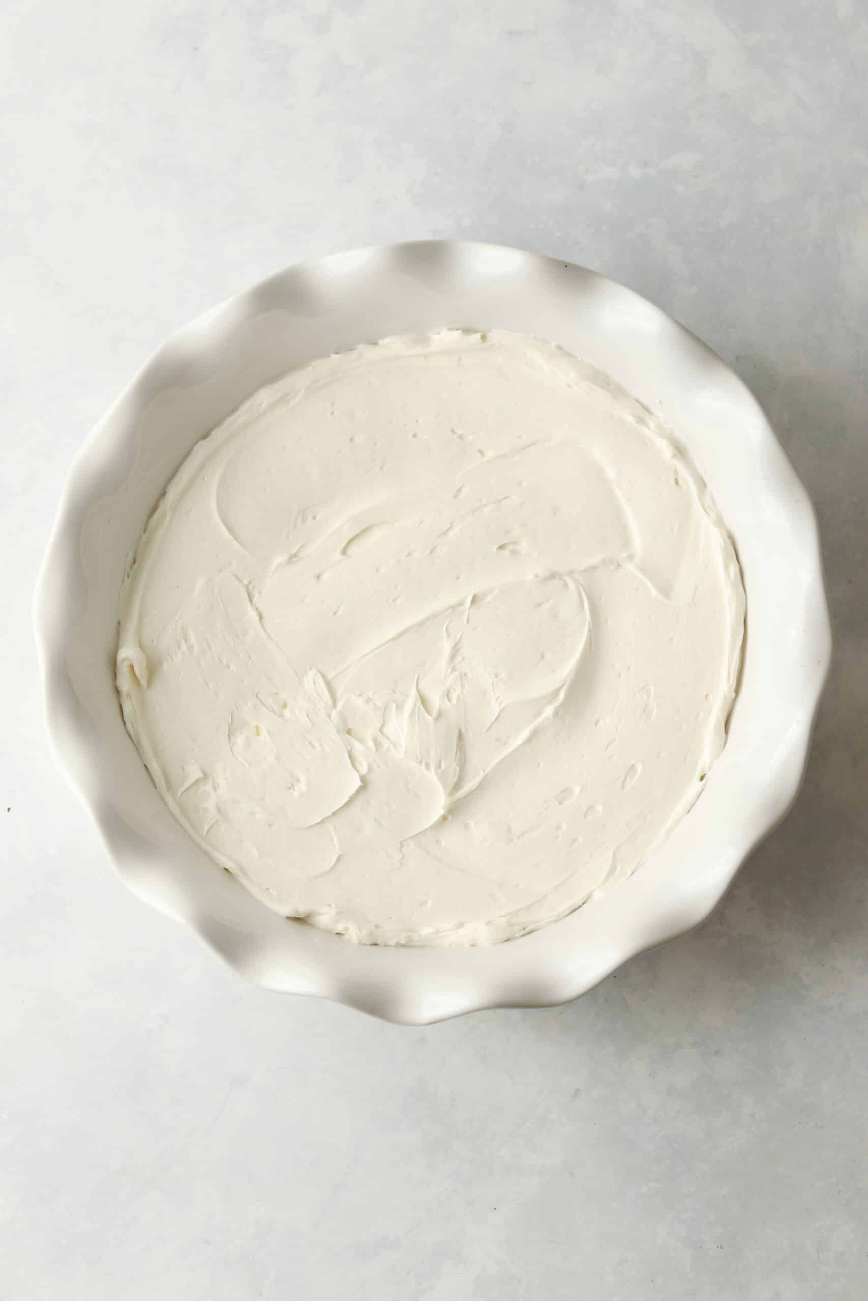 whipped cream cheese in a pie plate.