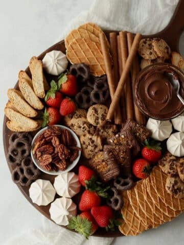 cookie charcuterie board with cookies, biscotti, and fruit.