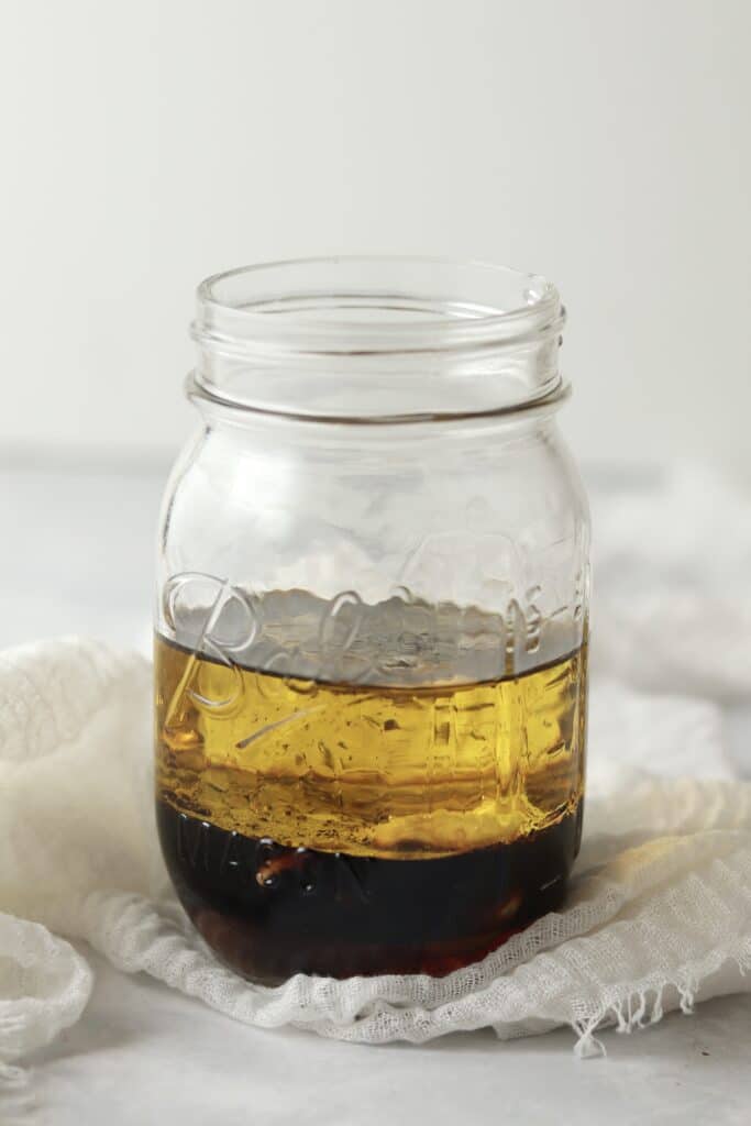 unmixed maple vinaigrette dressing in a jar