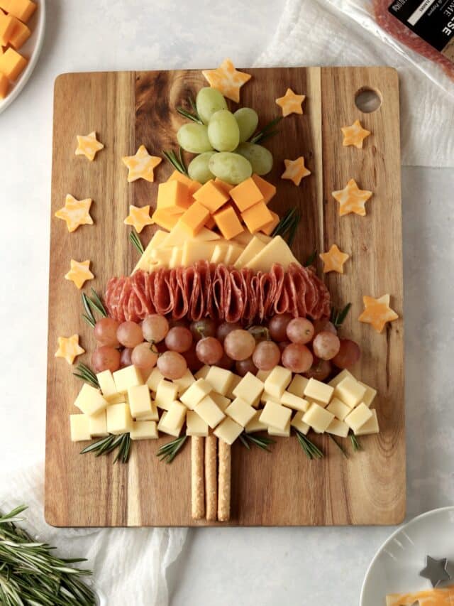Christmas charcuterie board with salami and rosemary