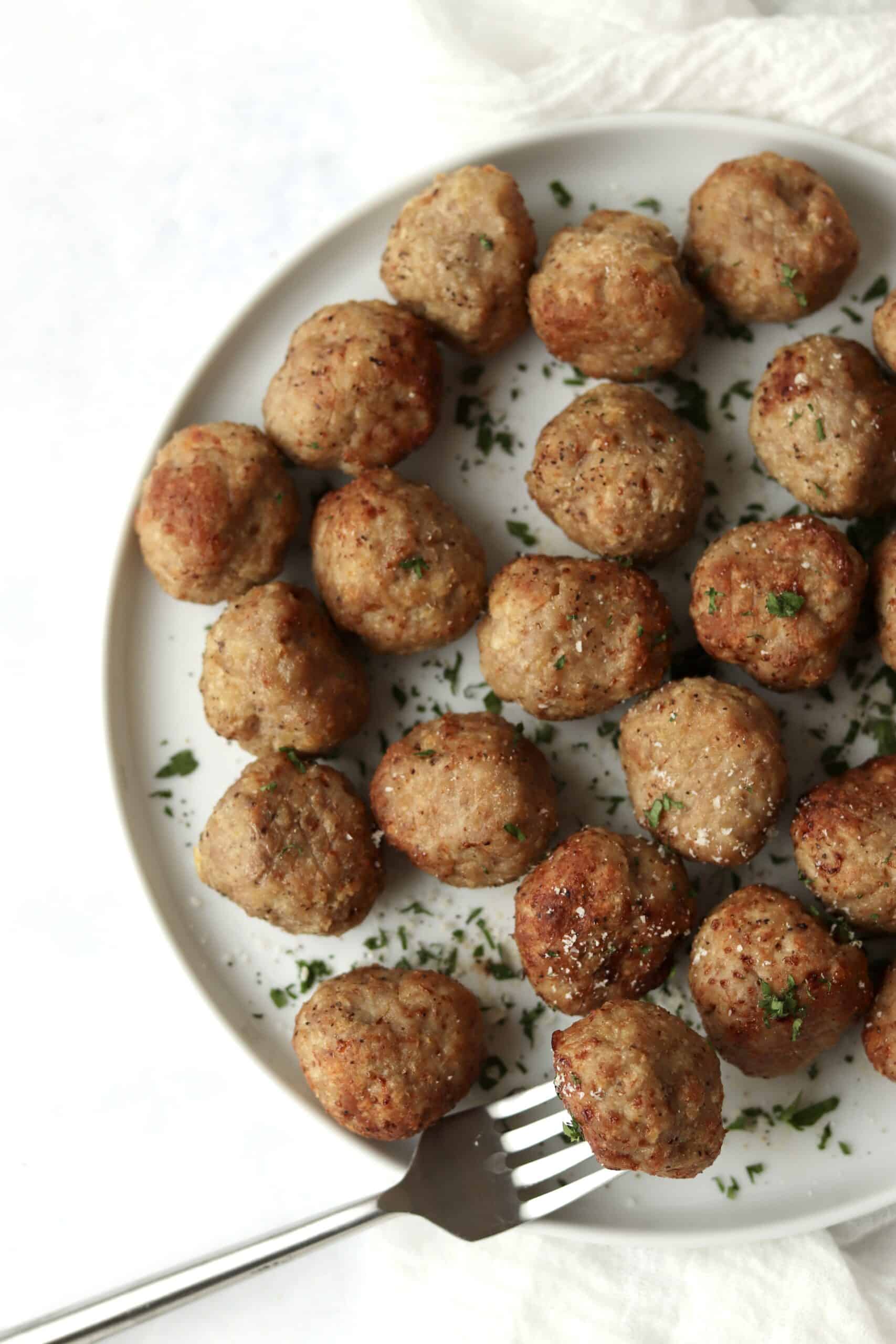 turkey meatballs on a plate with a fork