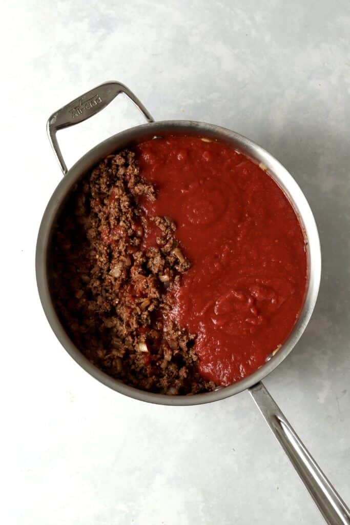 cooked ground beef with crushed tomatoes