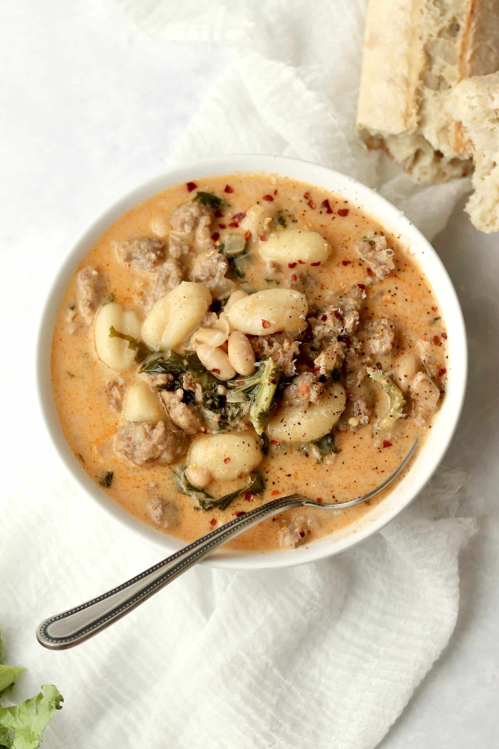 gnocchi sausage soup with kale in a bowl