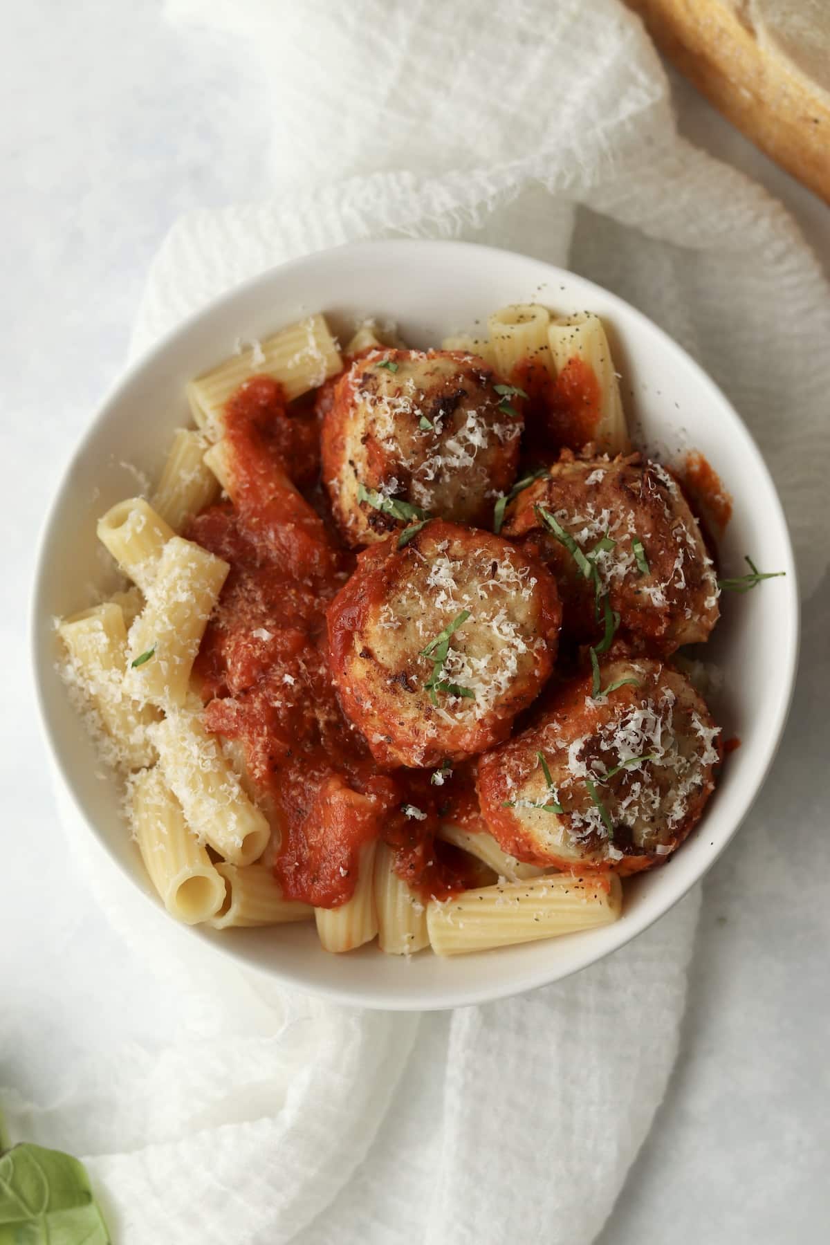 chicken parm meatballs served with pasta