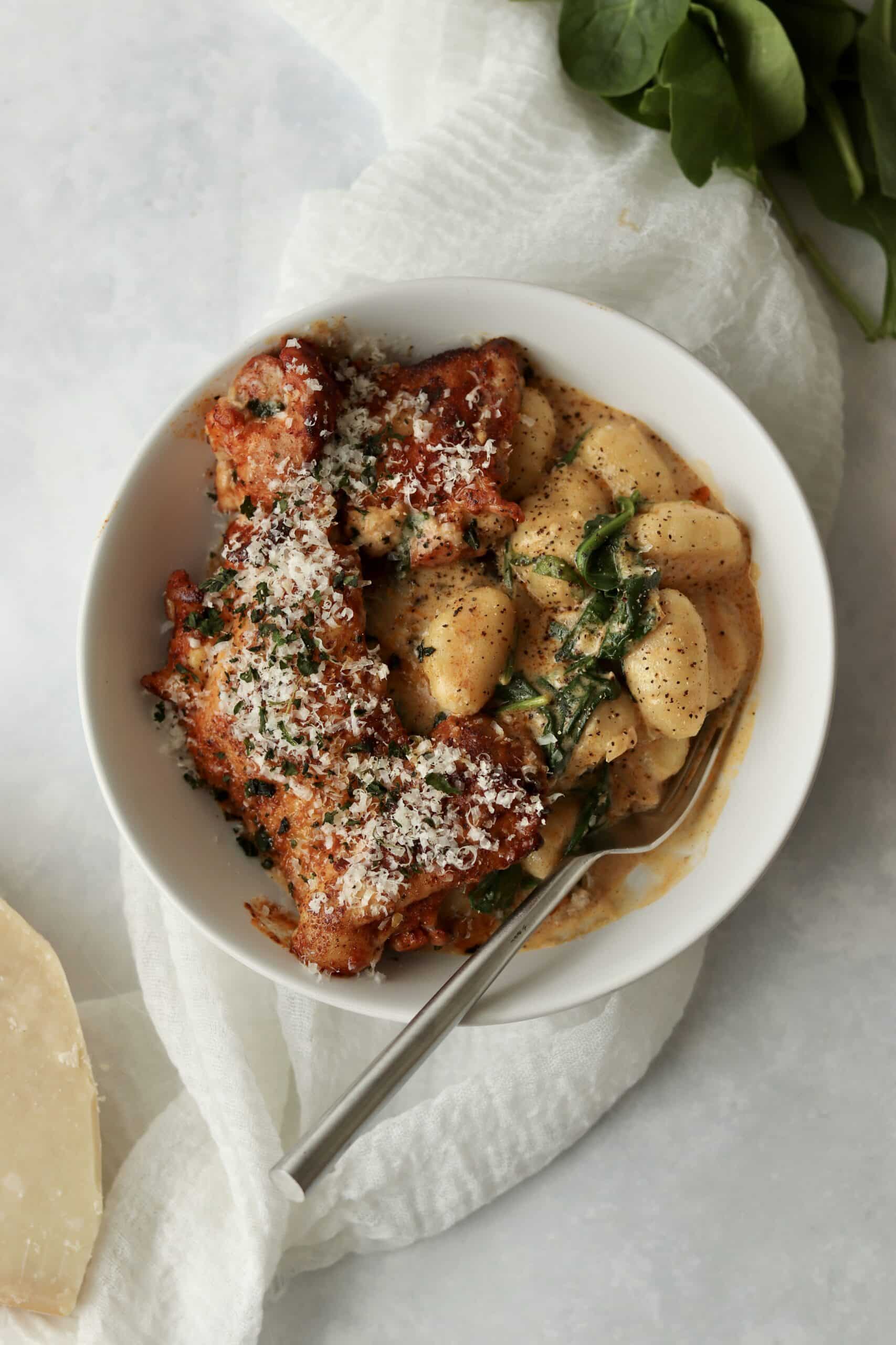 chicken and gnocchi in cream sauce with parmesan and spinach