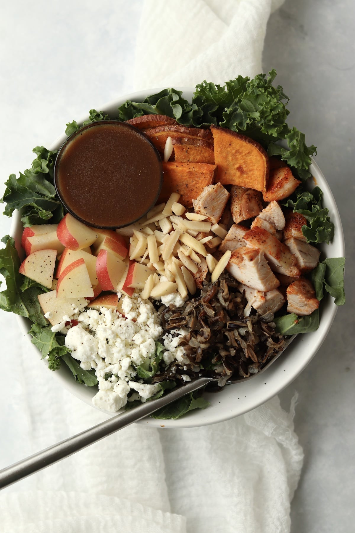 kale and wild rice bowl with chicken, goat cheese, and balsamic dressing