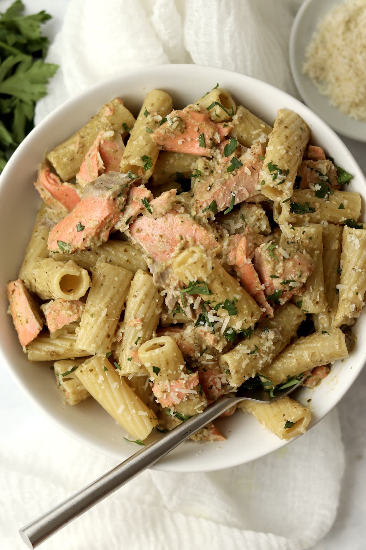 salmon pesto pasta with parsley and parmesan