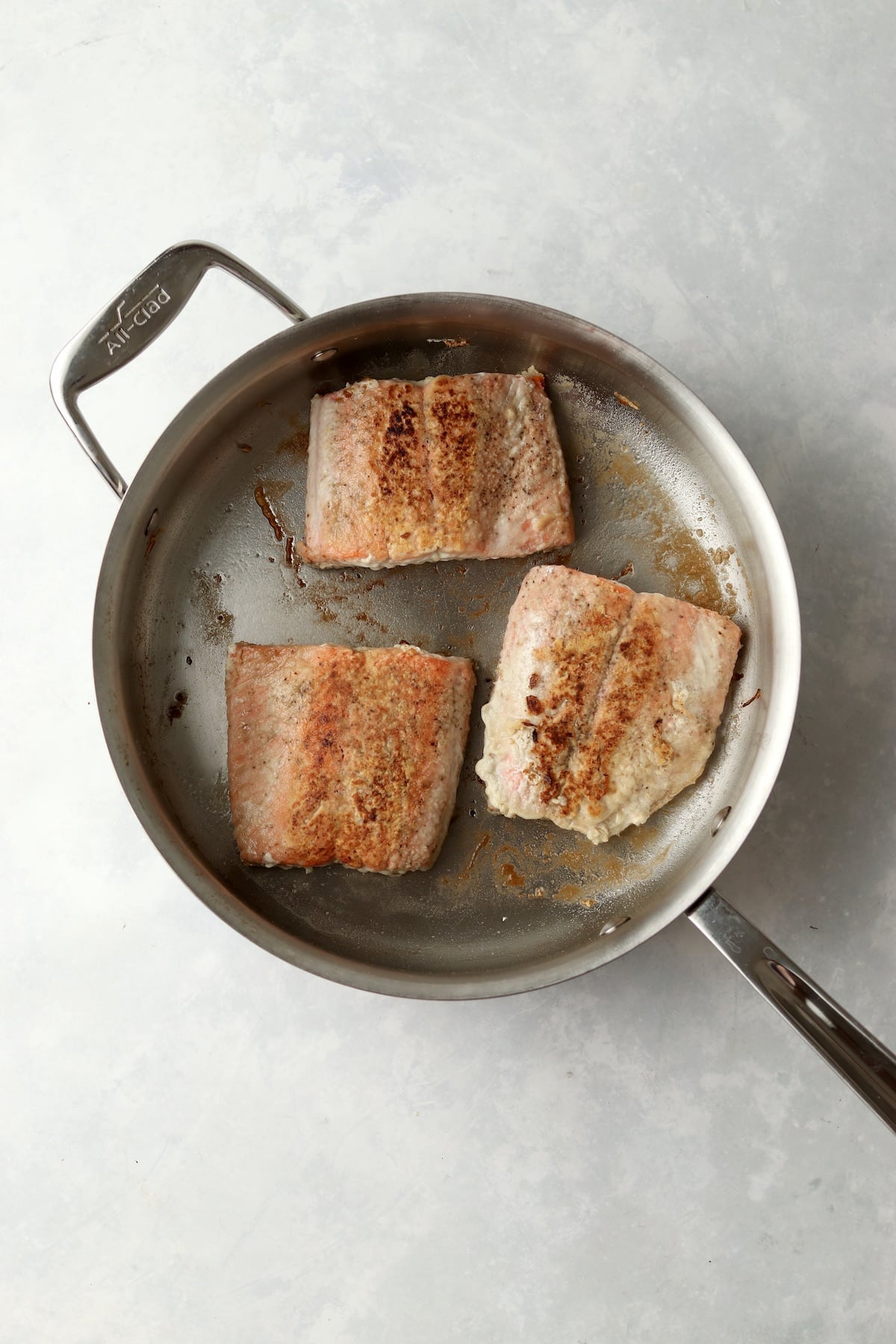salmon cooked in pan.