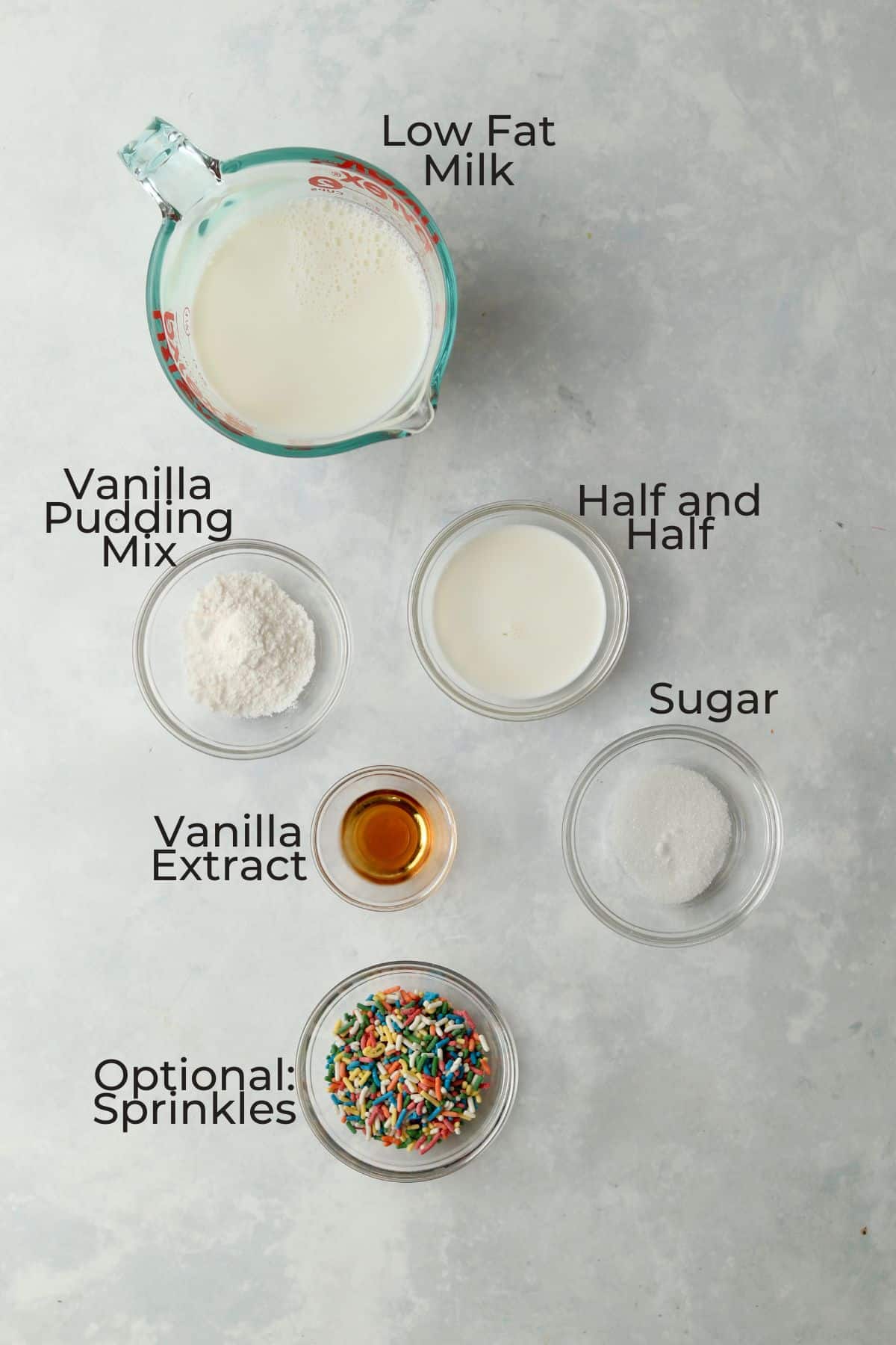 low fat milk, half and half, pudding mix, vanilla extract, sugar, and sprinkles in small bowls