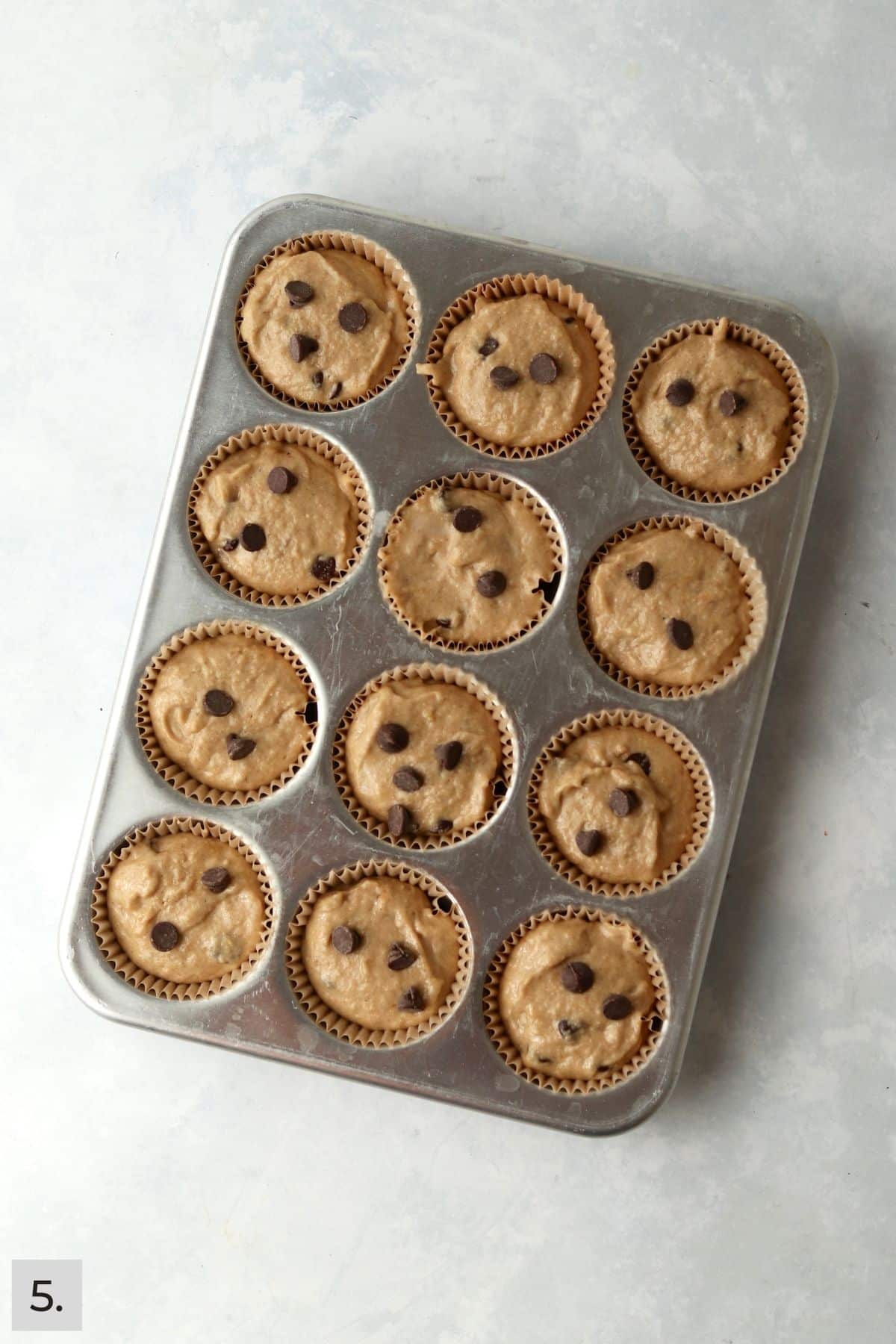 Unbaked protein banana muffins in cupcake pan.