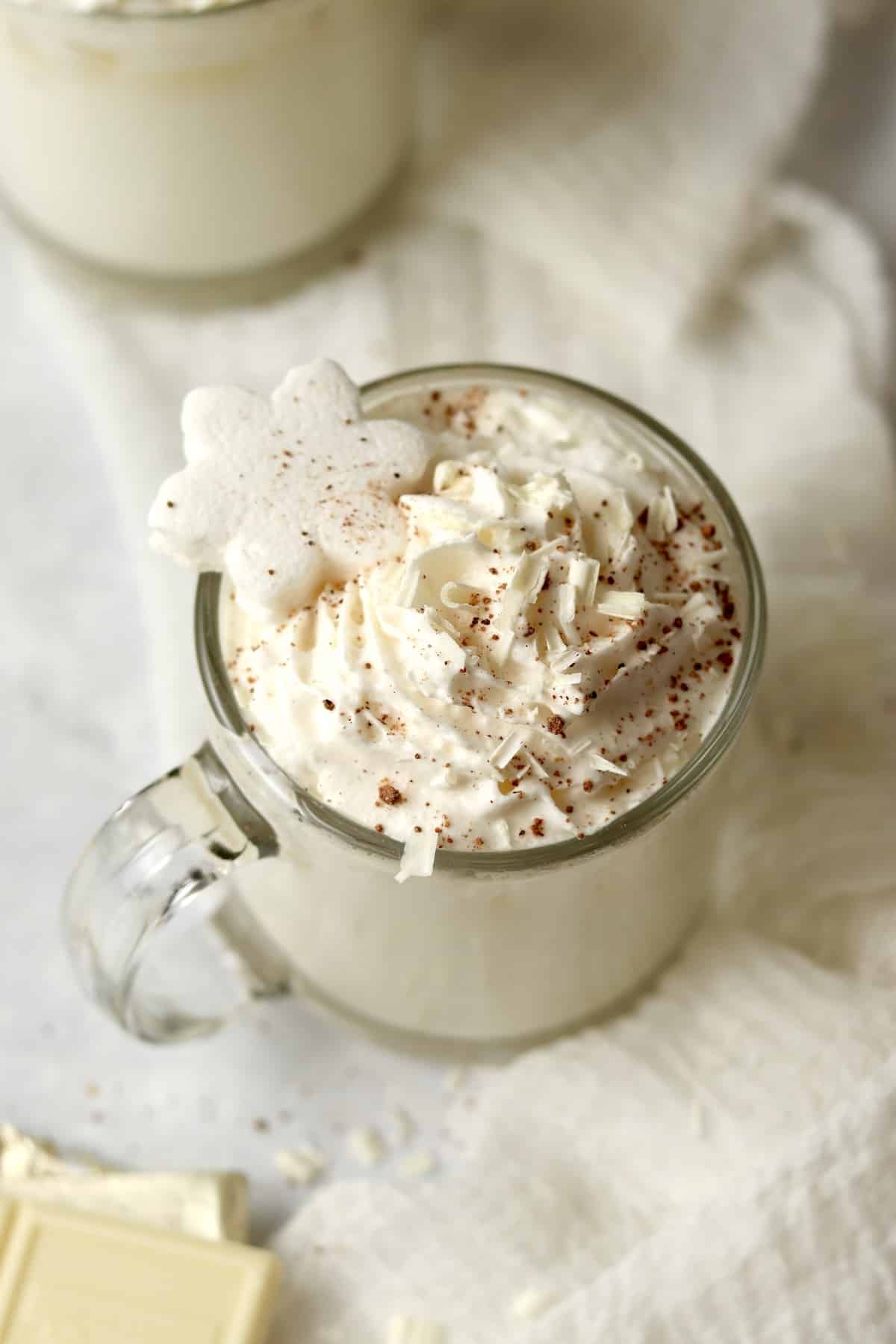 white hot chocolate Starbucks copycat in mugs with chocolate shavings.