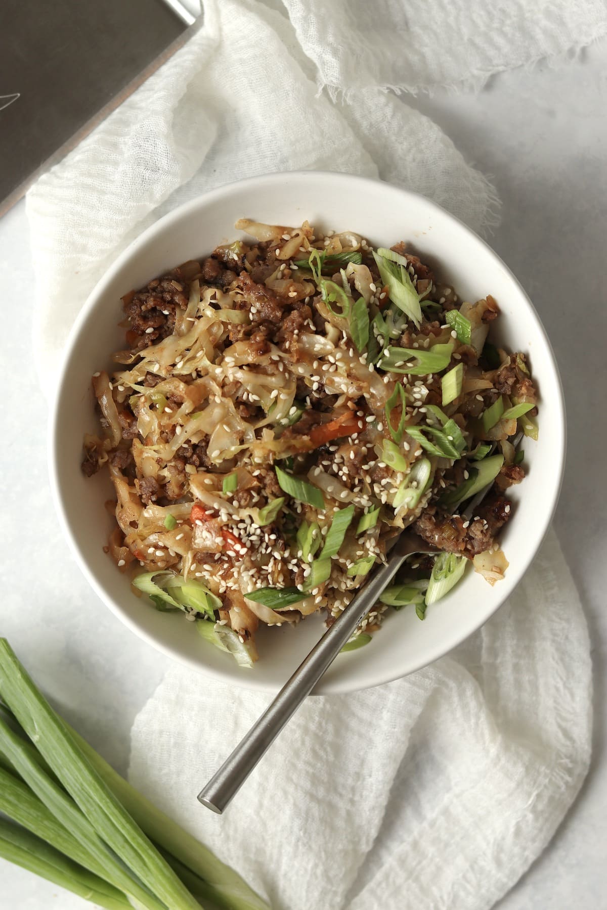 Bowl of Blackstone egg roll in a bowl with a Blackstone spatula next to it.