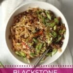 Blackstone egg roll in a bowl with green onions.