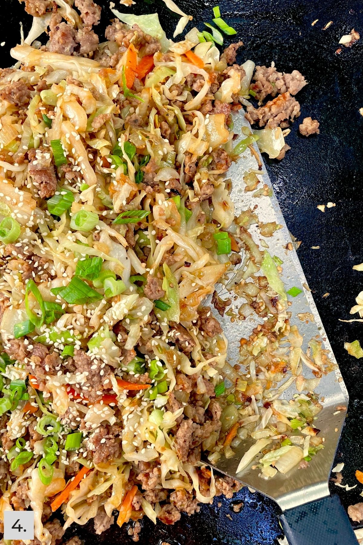 Cooked egg roll bowl mixture on the Blackstone.