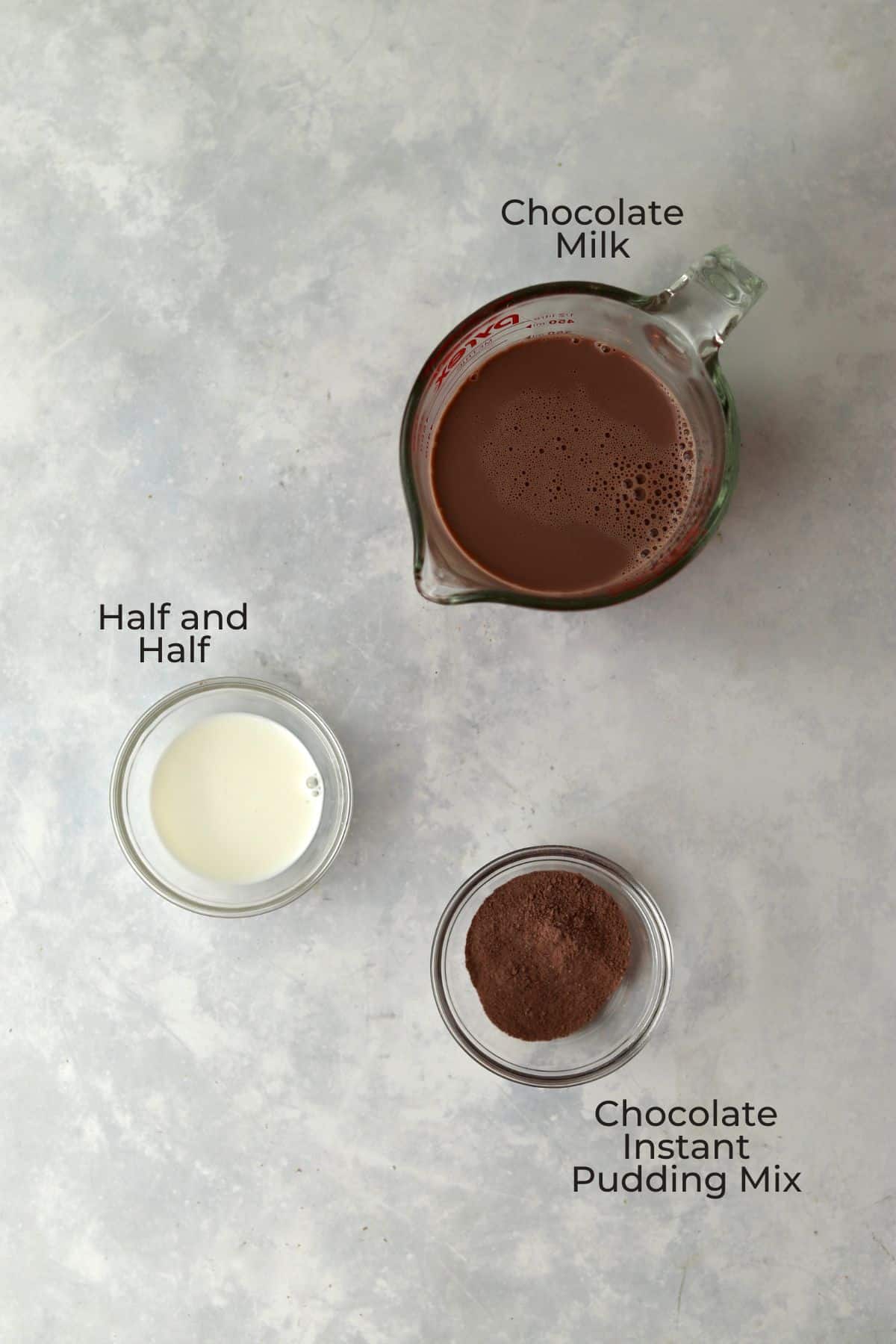 Chocolate milk, half and half, and instant pudding mix in glass prep bowls.