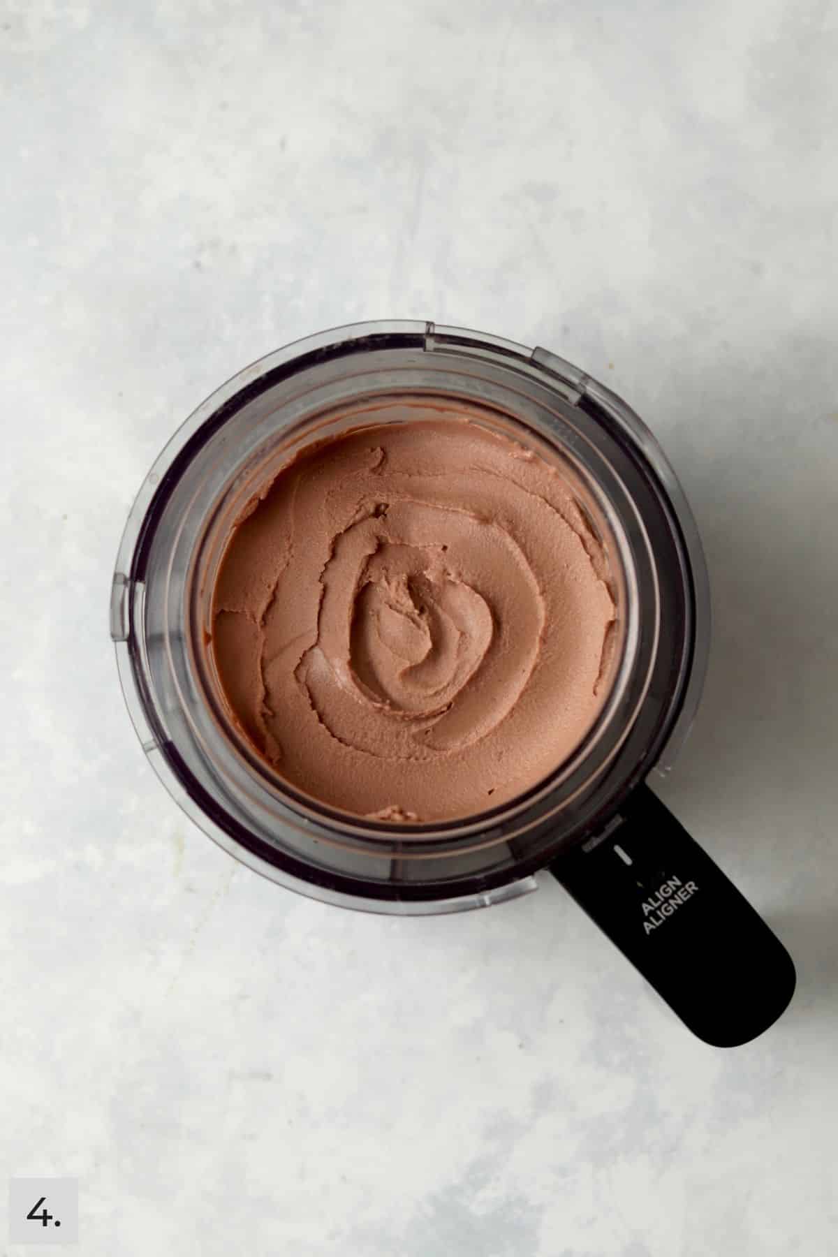 Chocolate soft serve that is creamy on top in Ninja Creamy pint container.