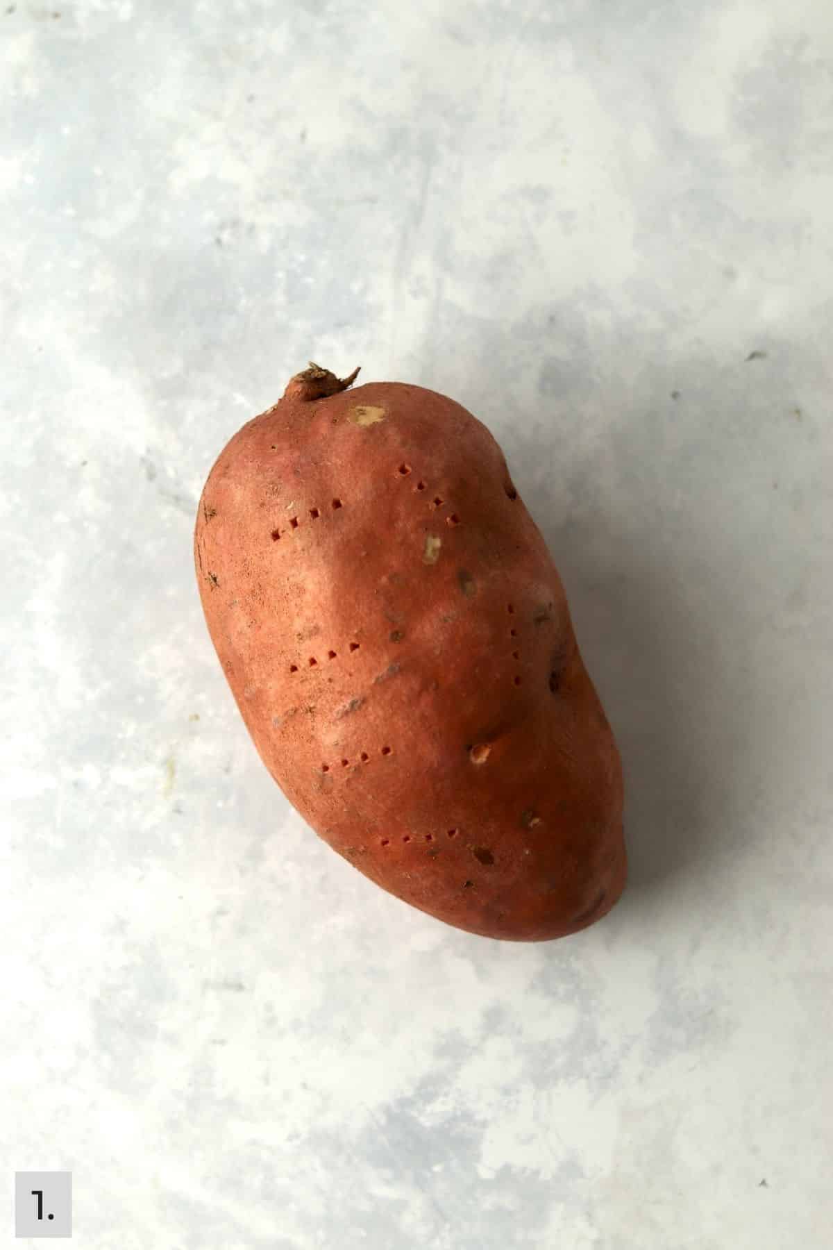 Sweet potato pierced with a fork.