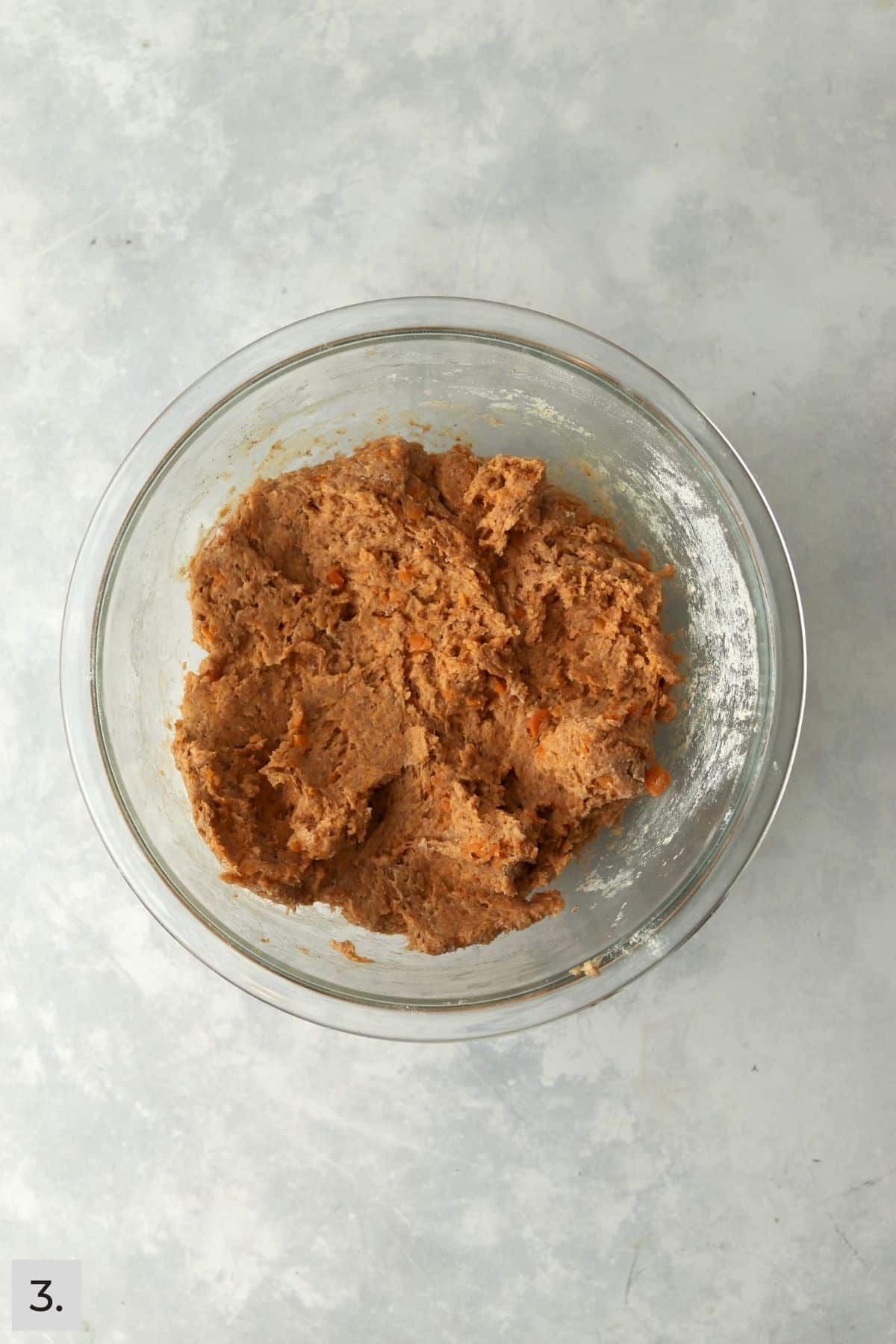 Sweet potato dog treat dough in a glass mixing bowl.