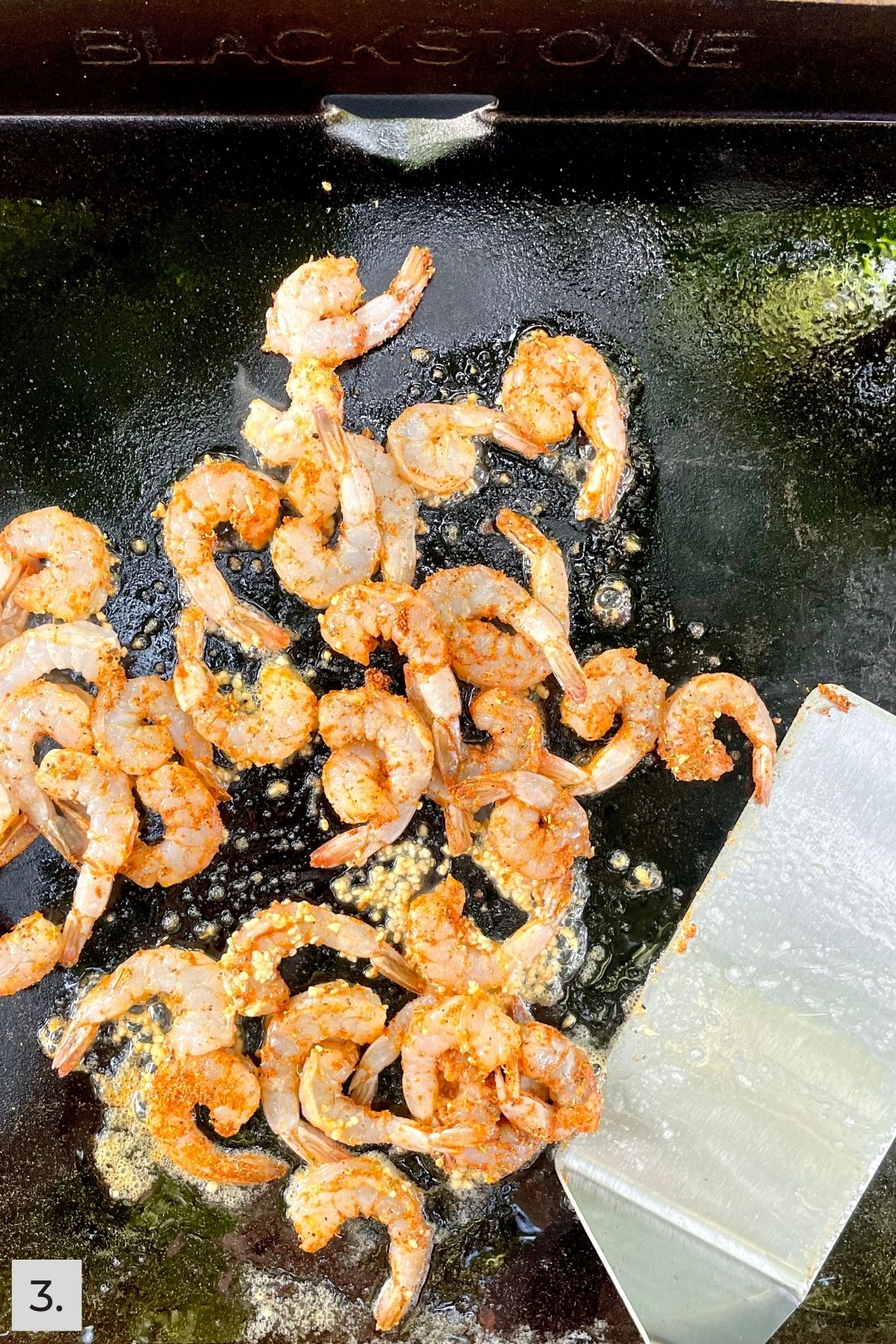 Shrimp being cooked on the Blackstone griddle.