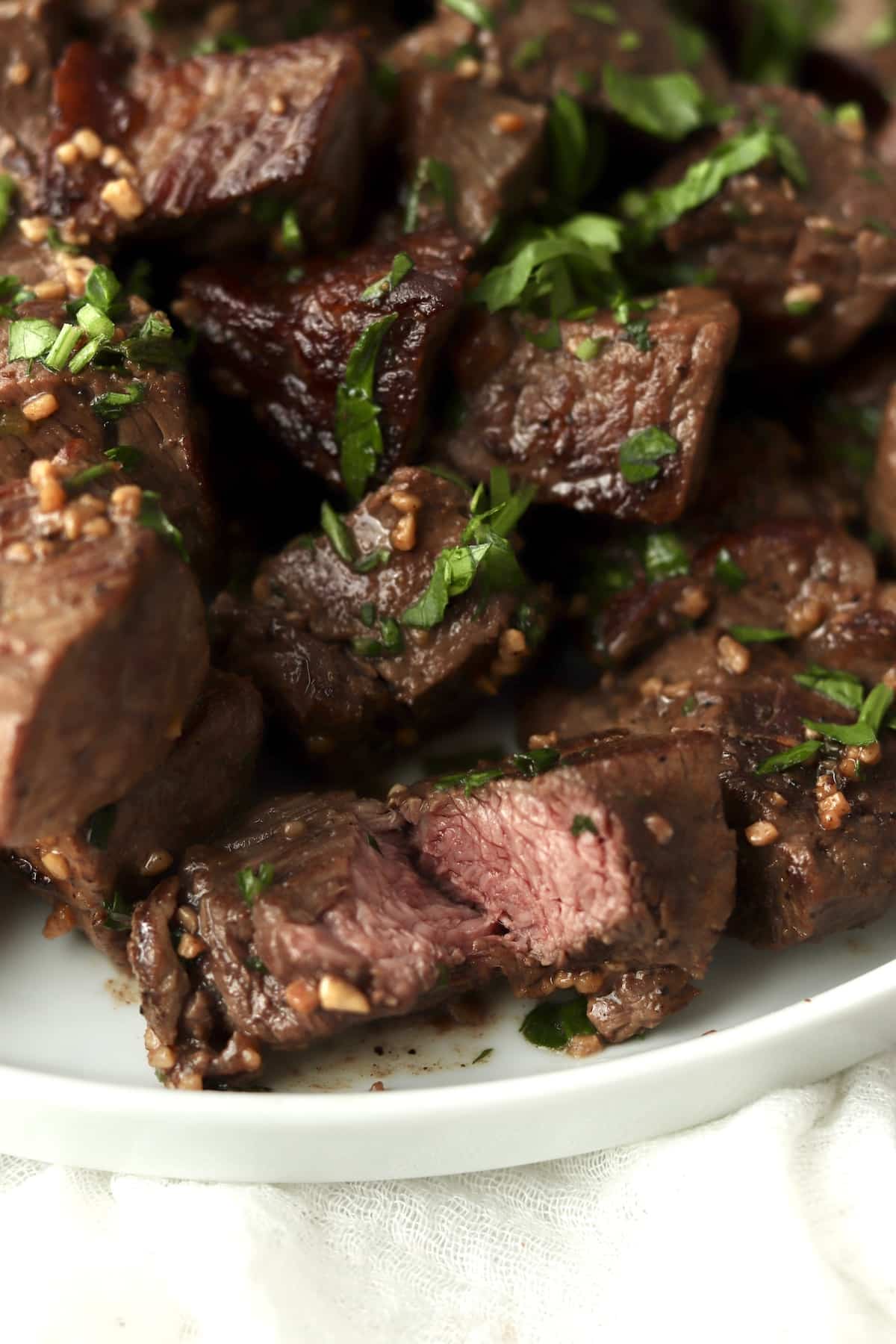 Steak bite being cut into and showing the medium on the inside.