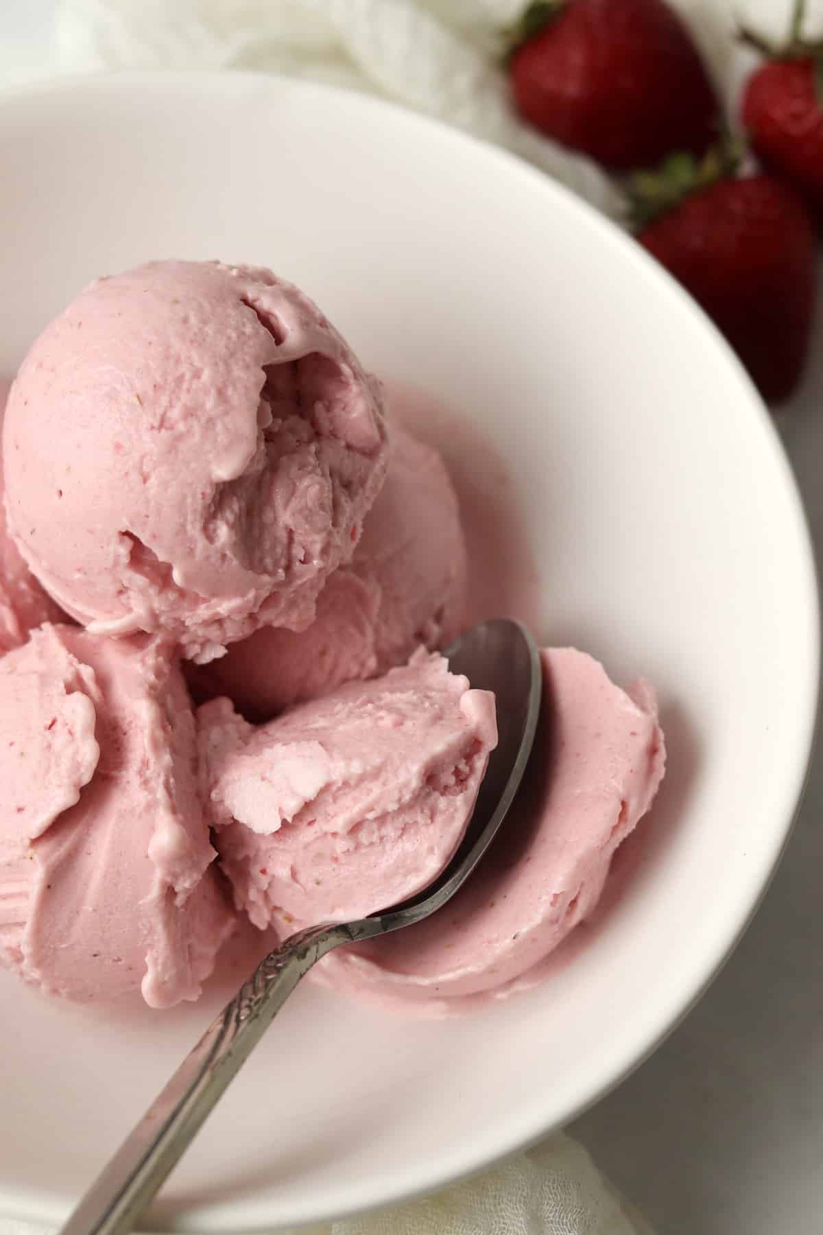 Scoops of Ninja Creami Strawberry Frozen yogurt in a bowl.