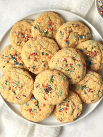 Plate of funfetti cake mix cookies with sprinkles.