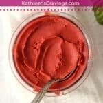 Creamy strawberry basil sorbet in Ninja Creami pint container.