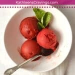 Scoops of strawberry basil sorbet in a bowl.