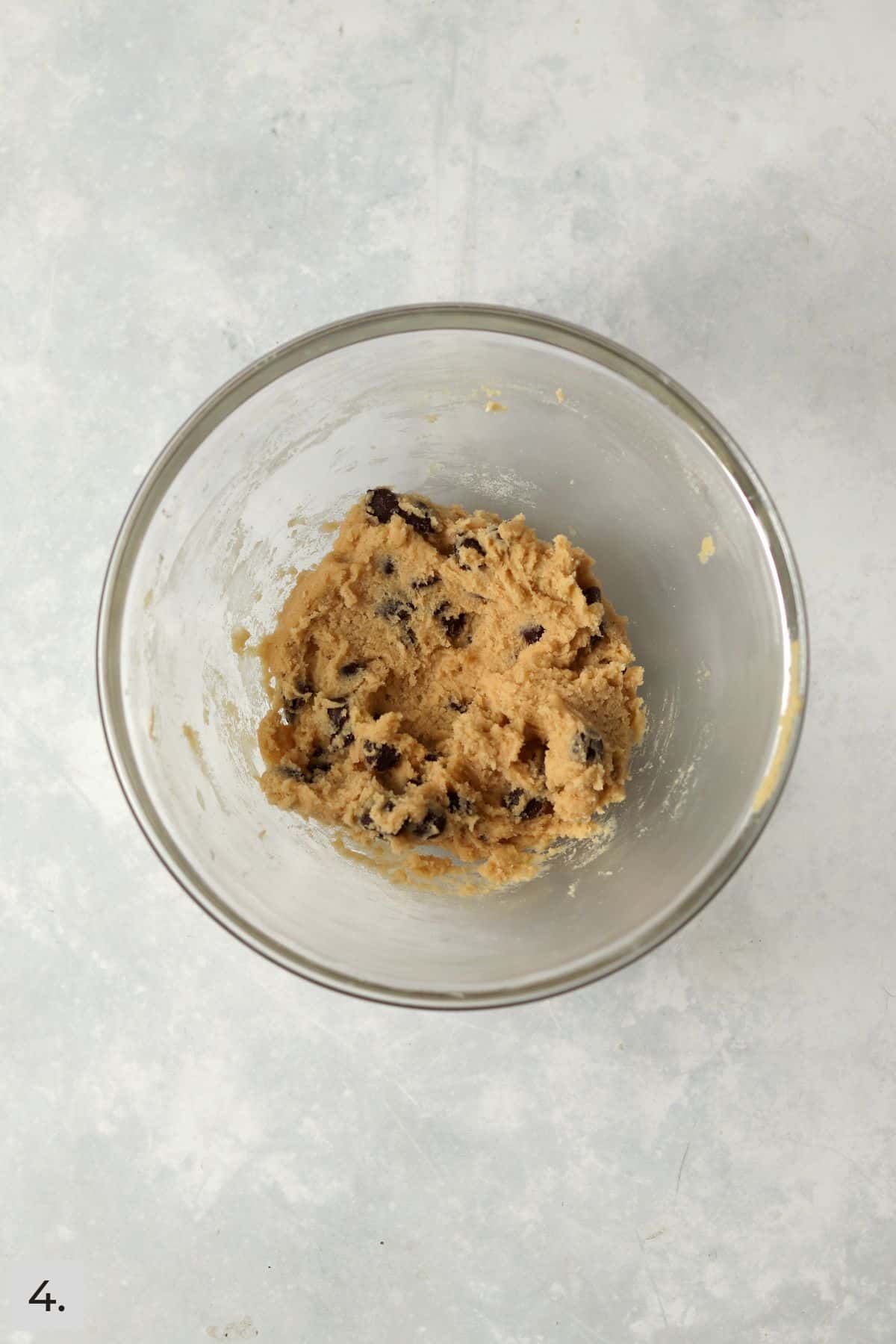 Small batch chocolate chip cookie dough in glass bowl.