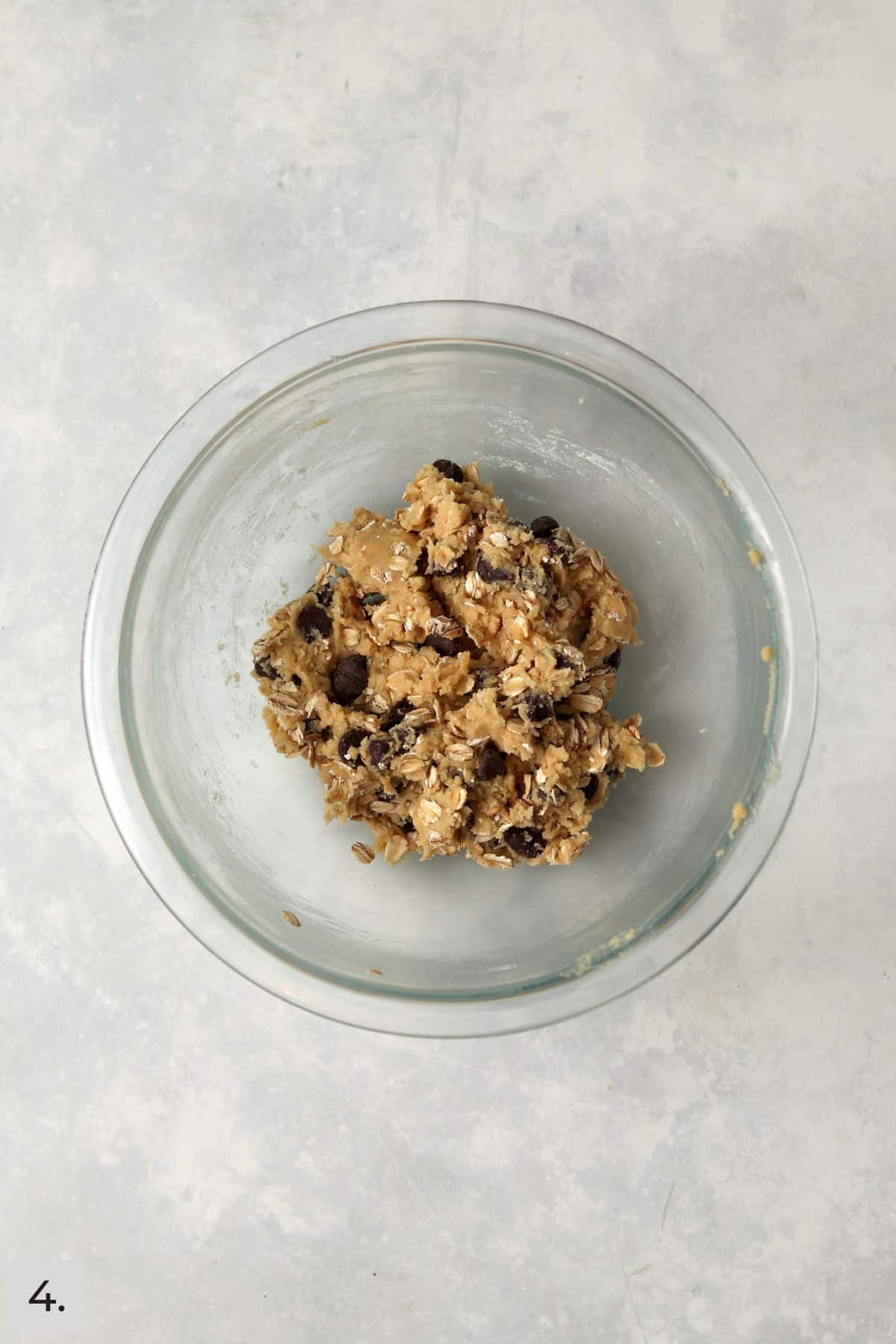 Small batch oatmeal chocolate chip cookie dough in glass bowl.