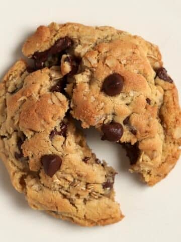 Single serve oatmeal chocolate chip cookie split in half.