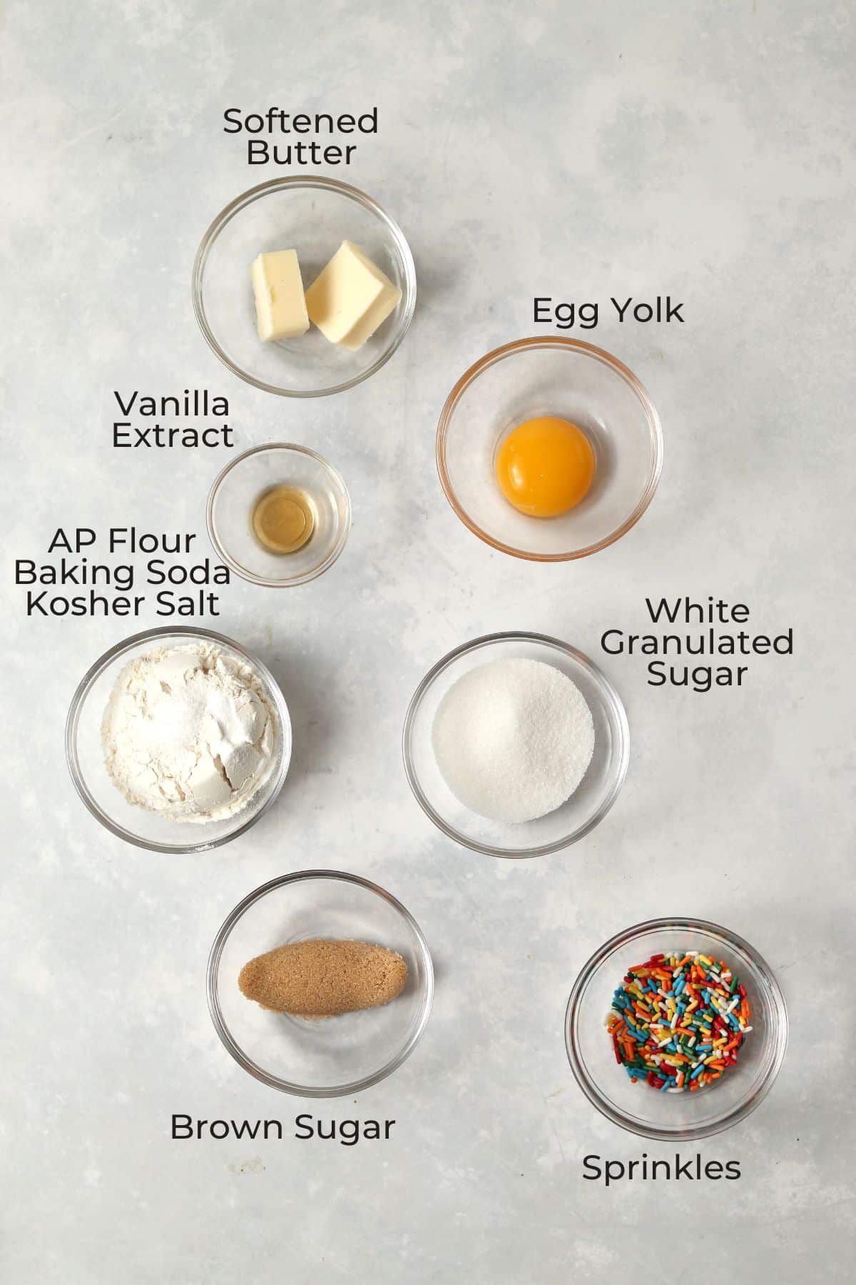 Single serve sugar cookie ingredients in small glass prep bowls.