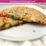 Single serve sugar cookie broken in half to show tender center.