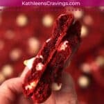 Hand holding a red velvet cake mix cookie.