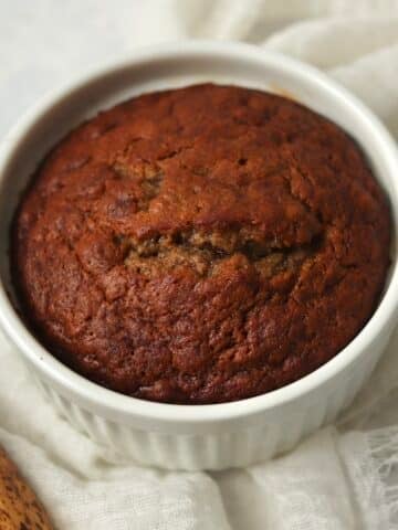 Single serve banana bread in a ramekin.