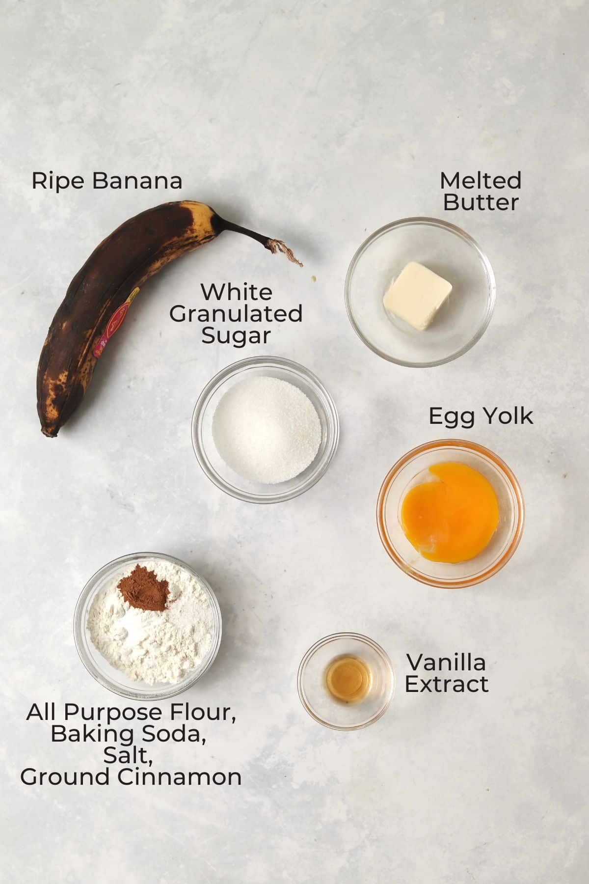 Small batch banana bread ingredients in glass prep bowls.