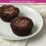 Single serve brownie on a plate with powdered sugar.